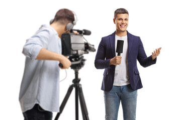 Cameraman recording a male reporter with a microphone gesturing with hand