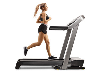 Poster - Full length profile shot of a female running on a treadmill