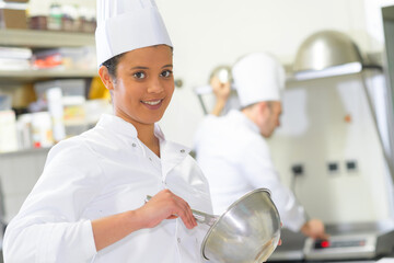 a female chef beating egg