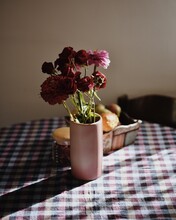 Close-up Of Flowers In Vase On Table At Home