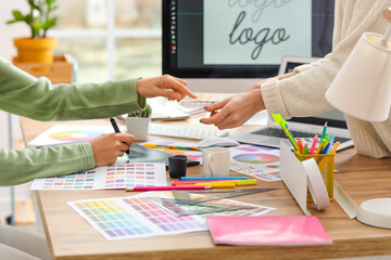 Poster - Graphic designer with colleague working in office