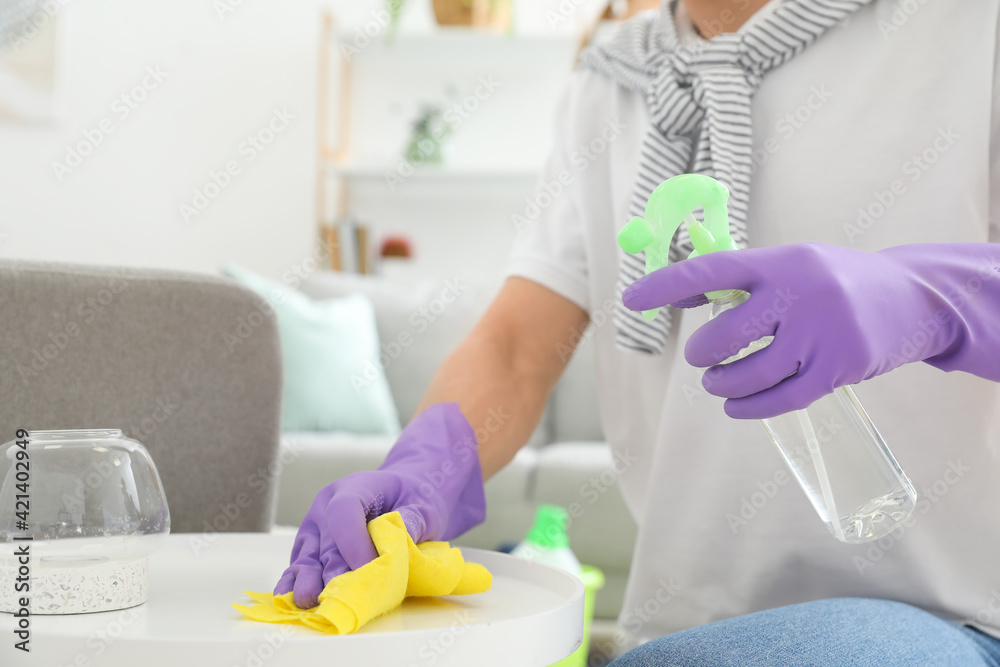 Young man cleaning his flat