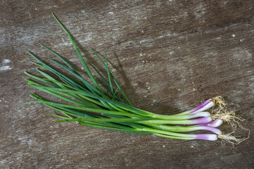 Fresh scallions on the board