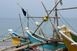 At Kumarakanda, Sri Lanka, traditional outrigger fishing boats (oruwa or sea canoes) crowd a beach on the Indian Ocean.