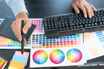 Poster - creative graphic designer choosing color scale for editing artwork while working in office.