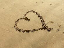 Close-up Of Heart Shape On Sand