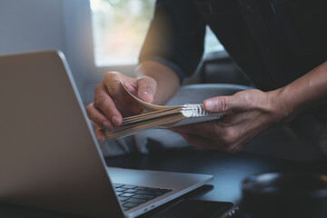 Poster - casual business man working in modern office with laptop computer and notebook on table