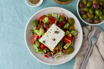 Wall Mural - Greek village salad horiatiki with feta cheese and vegetables, vegeterian mediterranean food, low calories keto dieting meal