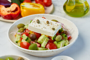 Wall Mural - Greek village salad horiatiki with feta cheese and vegetables, vegeterian mediterranean food, low calories keto dieting meal, side view, close up