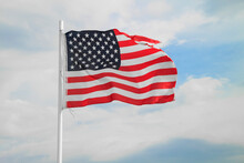 Low Angle View Of American Flag Against Sky