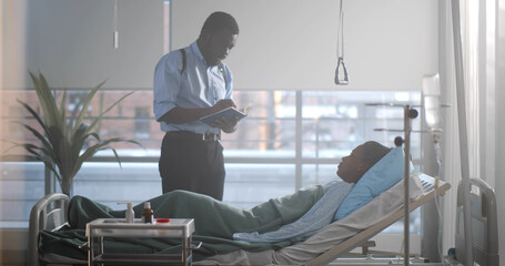 Afro-american detective interrogating woman victim lying in hospital bed