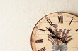 A Provence style decoupage clock hangs on the wall. Roman numerals