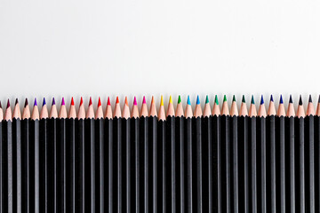 Wall Mural - Collection of multicolored pencils on a white background.