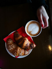 Wall Mural - Breakfast with coffee and croissants on table