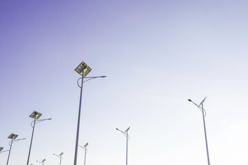 Wall Mural - solar cell lamp electricity system for alternative power energy on street with green tree nature, fu