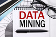 © Svetlana - Data Mining. text on white paper on financial charts background