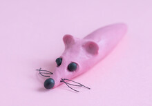 Pink Mouse Sausage Made Of Plasticine On A Pink Background, Children's Trend Toy