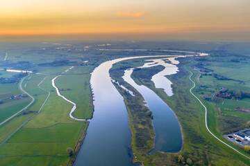 Canvas Print - Lowland river IJssel through sunset landscape