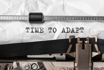 Poster - text time to adapt typed on retro typewriter