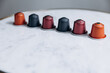 © Tymoshchuk - Six colorful pods for coffee machine standing in row