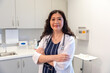 © Lynsey Weatherspoon/Creative Flame - Portrait of middle aged Chinese doctor in a medical exam room