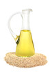 Sesame oil in a glass jug with sesame seeds