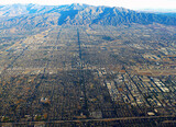 Fototapeta Na sufit - Early morning aerial view of Los Angeles City seen from an airplane window.