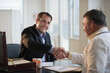 © Tetra Images/Tetra Images - USA, New Jersey, Jersey City, Medical sales representative shaking hands with doctor in office