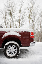 Rear Of Pickup Truck Covered In Snow