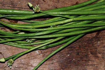 Sticker - Top view shot of a green onion bunch on a wooden table