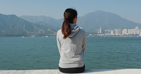 Sticker - Woman sits at the seaside