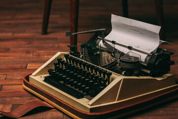 Fototapete - retro typewriter with keys letters wooden background white sheet of paper newspaper