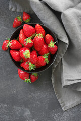 Wall Mural - Fresh strawberries in bowl on grey