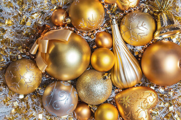 Amazing Christmas composition with gold christmas balls. Christmas or New Year concept. Top view. Winter holidays background. Christmas baubles. New year party invitation. 