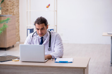 Young male doctor in telemedicine concept