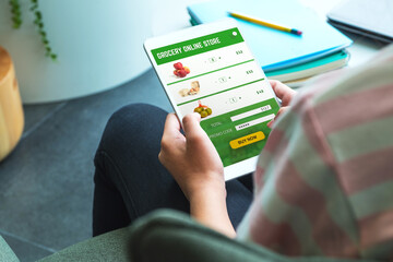 Poster - Close up woman hand holding grocery online store mobile apps order food online at home.stay at home concept