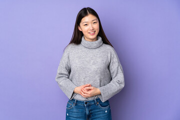 Poster - Young asian woman over isolated background laughing