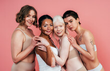 Group Of Multiethnic Women With Different Kind Of Skin Posing Together In Studio. Concept About Body Positivity And Self Acceptance