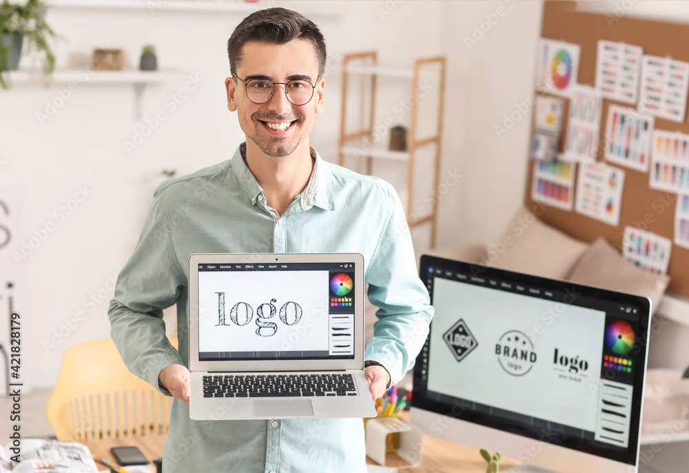 Graphic designer with laptop in office