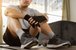 © C_Production - Tired sport man sitting and resting after exercise at home