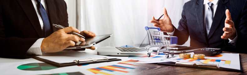 businesswoman hand using smart phone,mobile p payments online shopping,omni channel,digital tablet docking keyboard computer at office in sun light