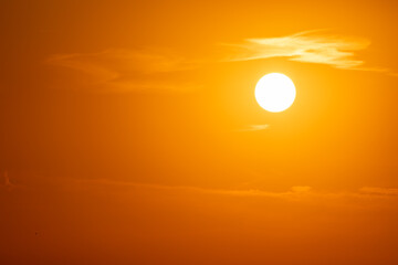 Golden hour sunset. View of sun. Details of sunset with orange sky.