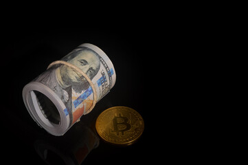 Money banknote and golden bitcoin over black background