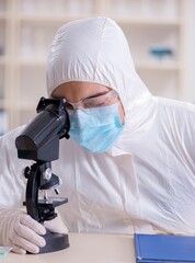 Wall Mural - Expert criminologist working in the lab for evidence