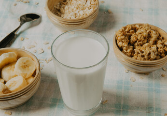 Healthy breakfast - milk with muesli and banana - health and diet concept