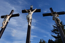 Low Angle Shot Of Statues Of People Crucified On Crosses