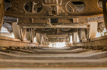 Bottom View Of A Locomotive Between The Rails And Wheels In Asukayama Park In Tokyo.