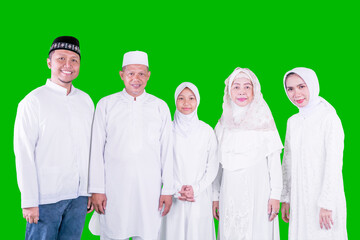 Wall Mural - Three generation Muslim family standing on studio