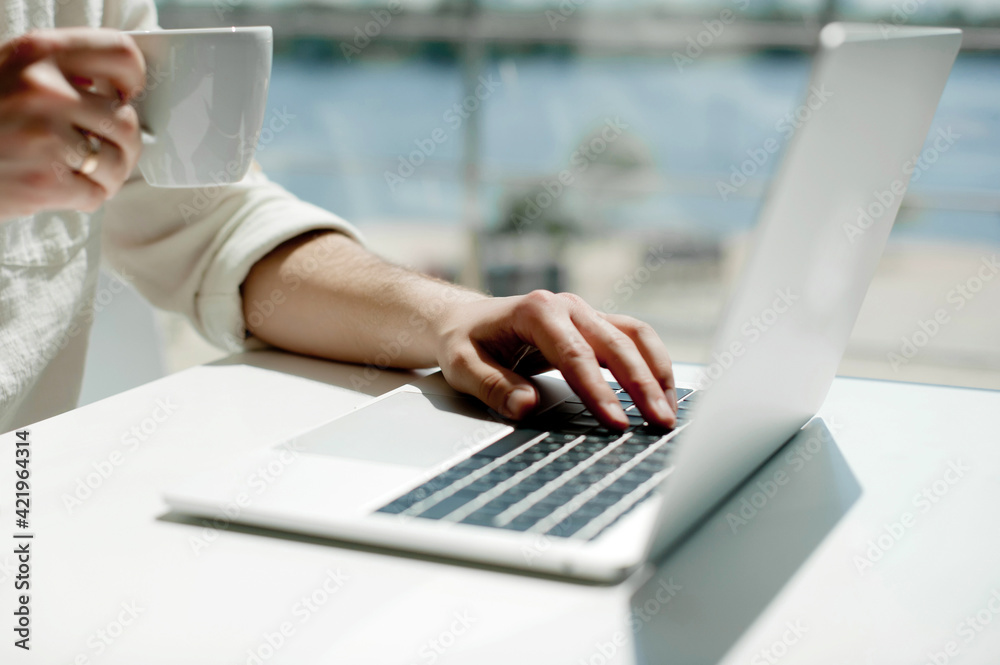 Midsection Of Man Using Laptop On Table - obrazy, fototapety, plakaty 