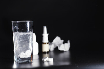 Wall Mural - Composition from Bottles of cough syrup.Healthcare, medicine, flu and treatment concept - paper wipes and thermometer with pills.